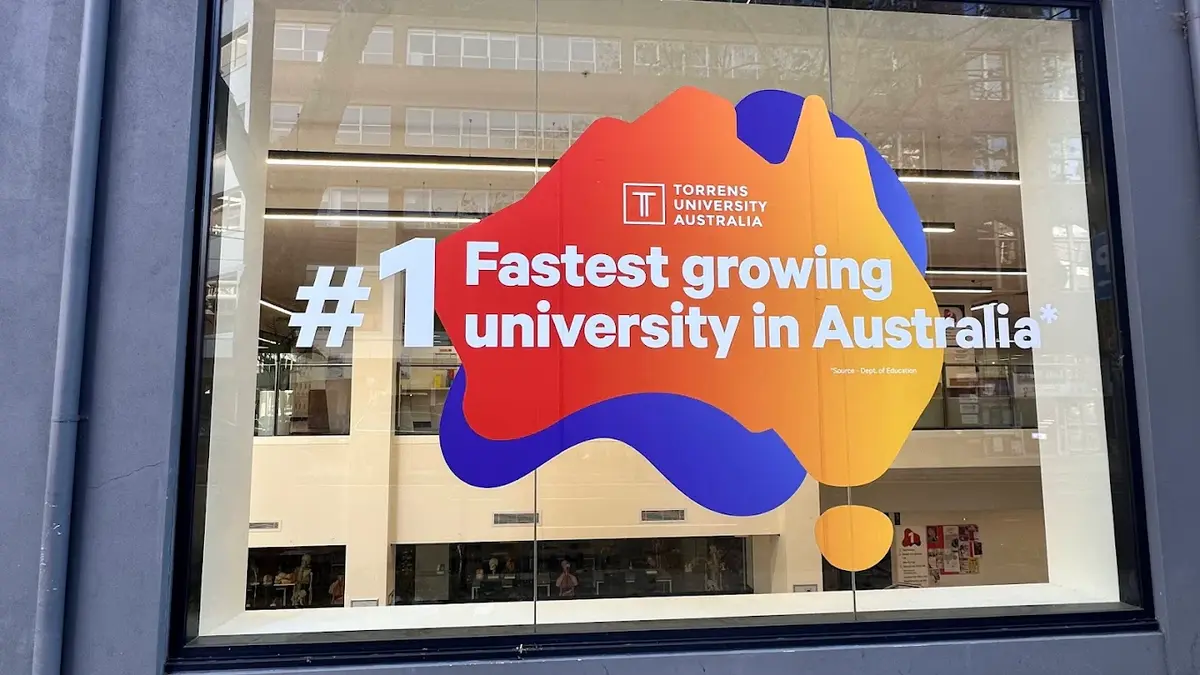 Torrens University fastest growing signage showing morphing brand shapes